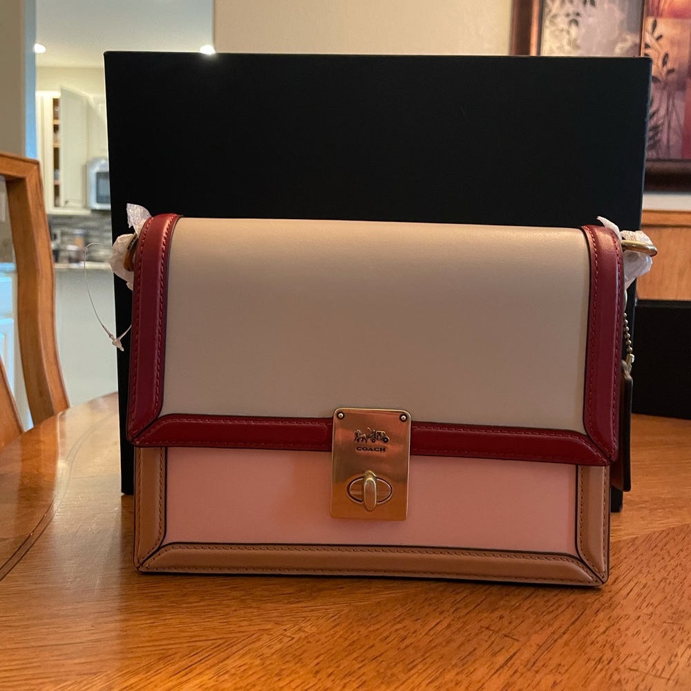 Coach purse. Cream, tan, light pink colors
